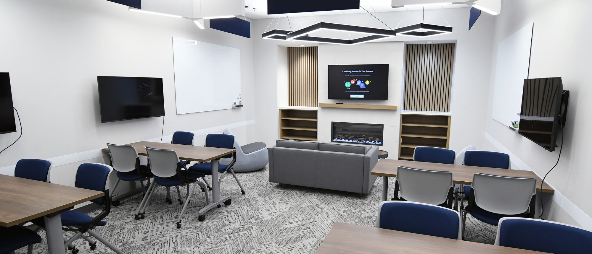 Students working in campus library computer room